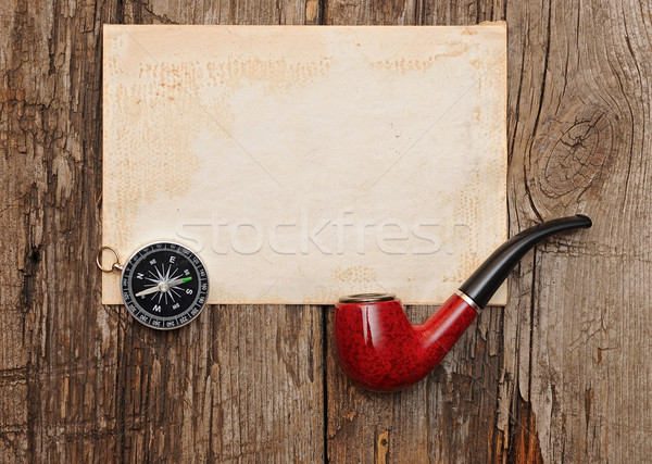 Compass and pipe on the old paper background  Stock photo © inxti