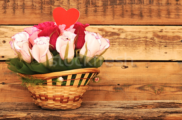Paper flower in a basket over wooden background. Love concept Stock photo © inxti
