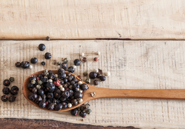  whole peppercorns on wooden spoons Stock photo © inxti
