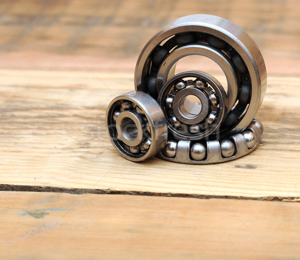 steel ball bearings on wooden background Stock photo © inxti