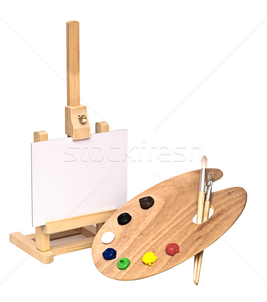 Wooden easel with clean paper and wooden artists palette loaded  Stock photo © inxti