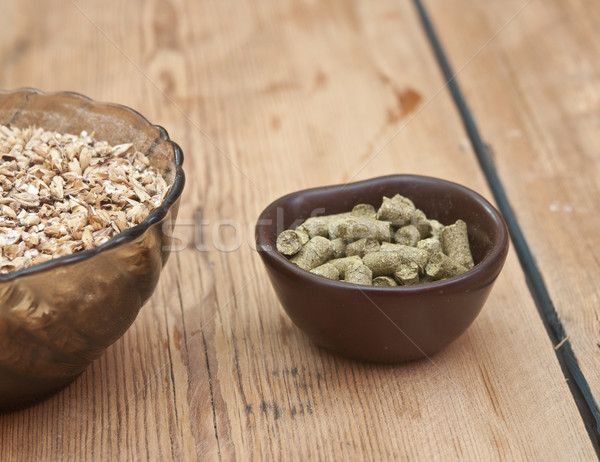 beer ingredients, hops and malt on wooden table top Stock photo © inxti
