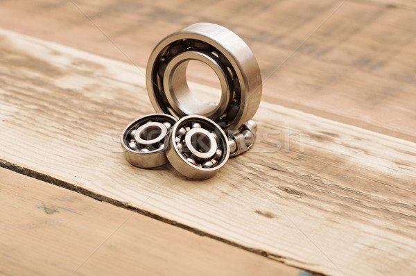 steel ball bearings on wooden table Stock photo © inxti