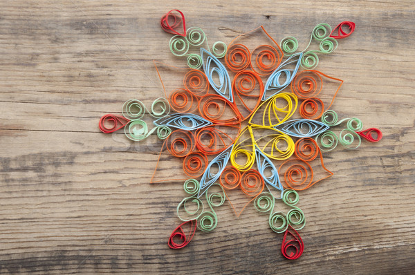 beautiful paper snowflake, on wood background  Stock photo © inxti