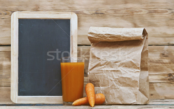 Healthy food - carrots and carrots juice with blank blackboard f Stock photo © inxti