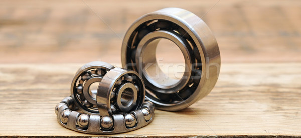steel ball bearings on wooden table Stock photo © inxti