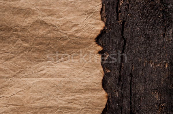 Burned old paper on border wood background  Stock photo © inxti
