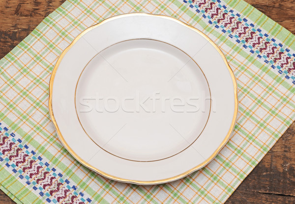 single white plate on old wood background  Stock photo © inxti