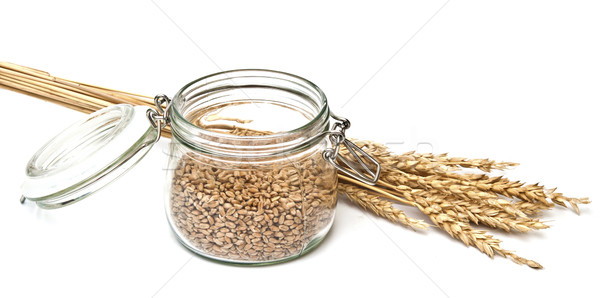 grain wheat in glass jar with spikelets on white background clos Stock photo © inxti