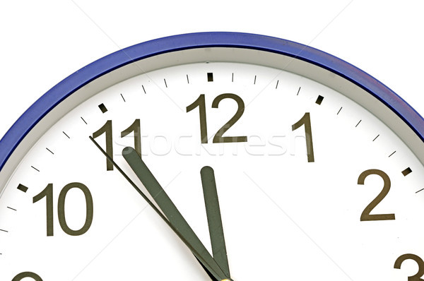 Stock photo: blue wall clock five minutes to twelve 