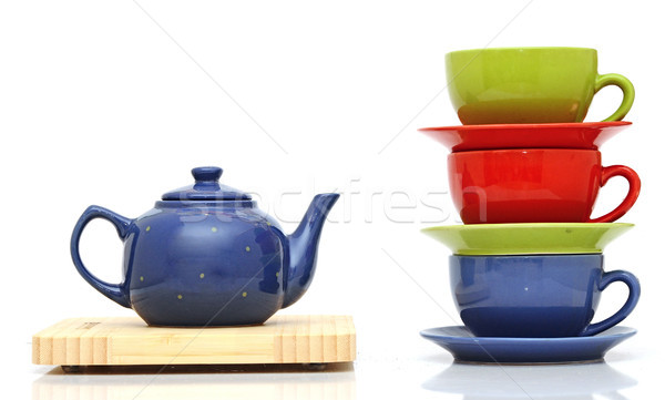Stock photo: Tea cups with teapot isolated on white