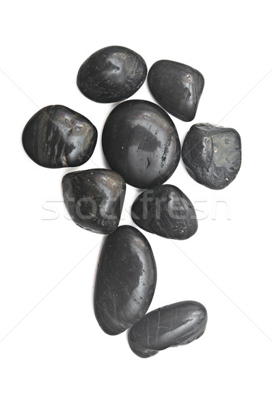 some black stones forming a flower on a white background  Stock photo © inxti