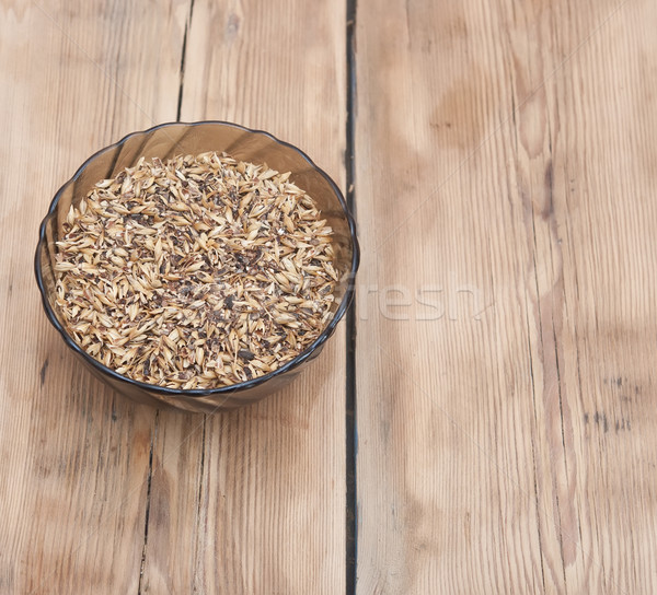 Barley grains of malt in glass bowl Stock photo © inxti