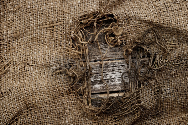 background of burlap with a hole for writing text. texture of th Stock photo © inxti