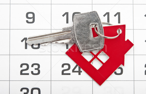 A house key on a calendar background Stock photo © inxti