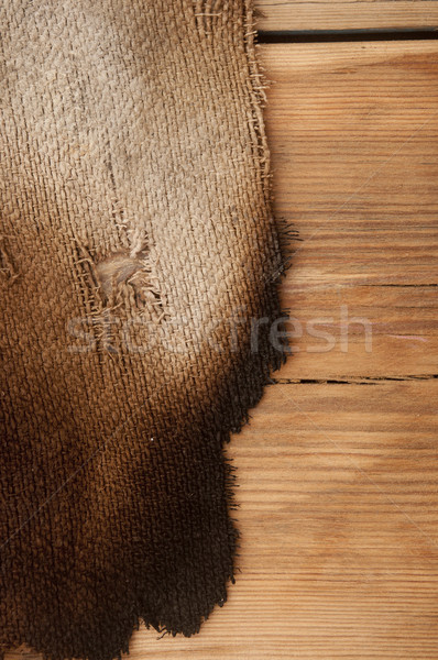 burned burlap on wood background  Stock photo © inxti
