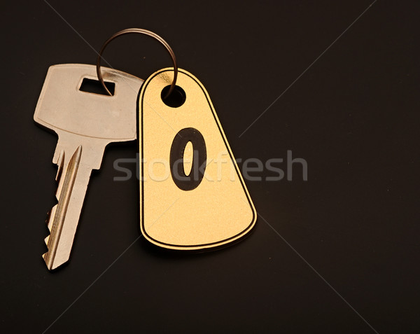 room key on black background with number 0 Stock photo © inxti