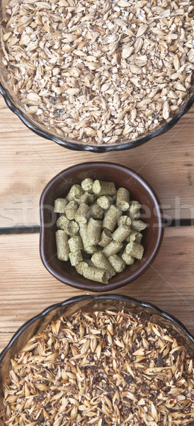 beer ingredients, hops and malt on wooden table top Stock photo © inxti