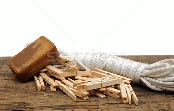 Stock photo: Soap, clothespins and rope on rustic table