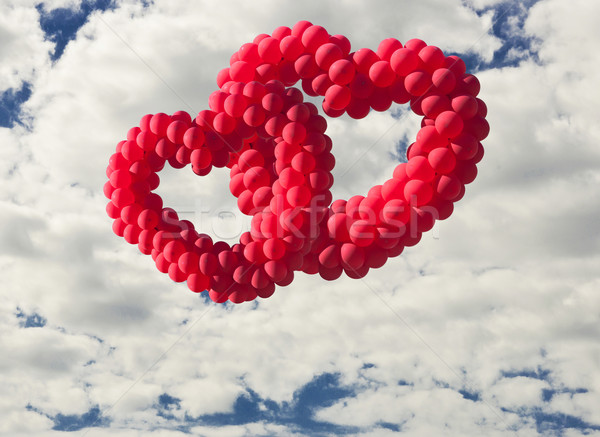 Two heart-shaped baloons in the sky, the symbols of love Stock photo © inxti