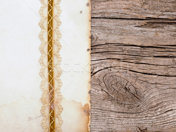 old paper with beutiful ribbon on brown wood texture  Stock photo © inxti