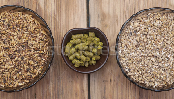 beer ingredients, hops and malt on wooden table top Stock photo © inxti