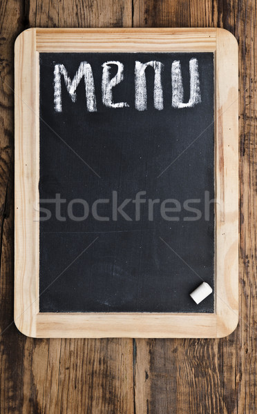 Menu title written with chalk on blackboard  Stock photo © inxti