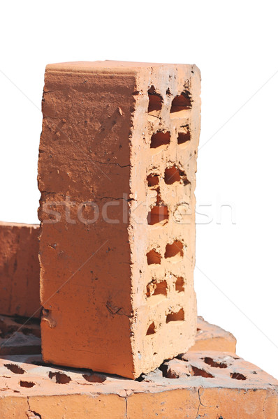 Stack of red bricks over white background  Stock photo © inxti
