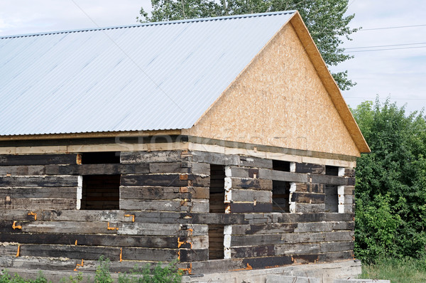 Unfinished wooden house and building area  Stock photo © inxti