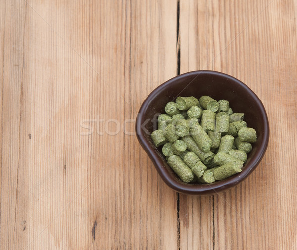 beer ingredients: toppellets of hops on wooden table Stock photo © inxti