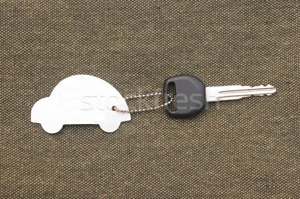 Keys to the car with trinkets in the form of a car. Stock photo © inxti