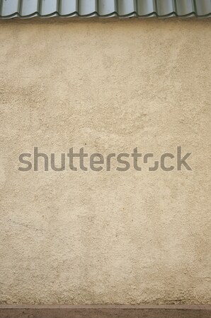 Old stone wall with metal roof tile Stock photo © inxti