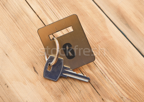 Hotel suite key with room number 6 on wood table  Stock photo © inxti