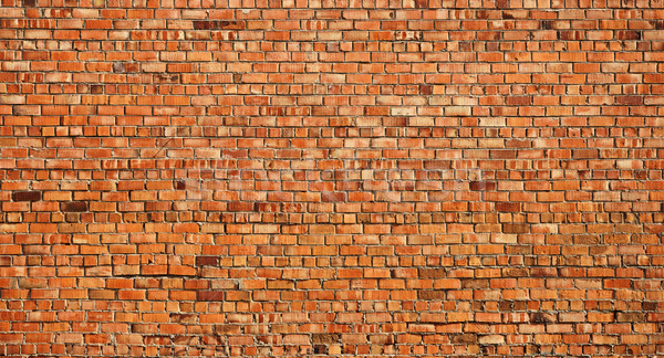 Verwitterten befleckt alten Backsteinmauer orange rock Stock foto © inxti
