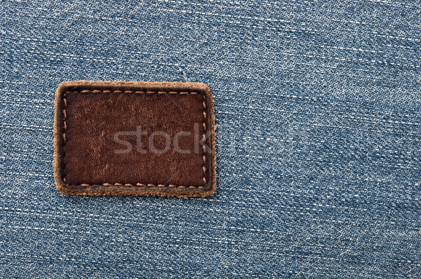Leather jeans label sewed on jeans. Stock photo © inxti