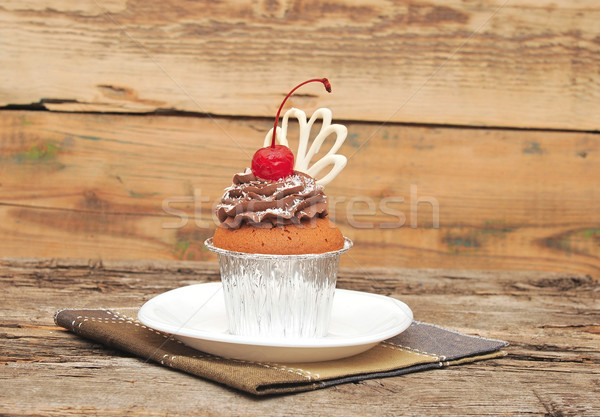 Chocolate cherry cupcakes on old wooden background Stock photo © inxti