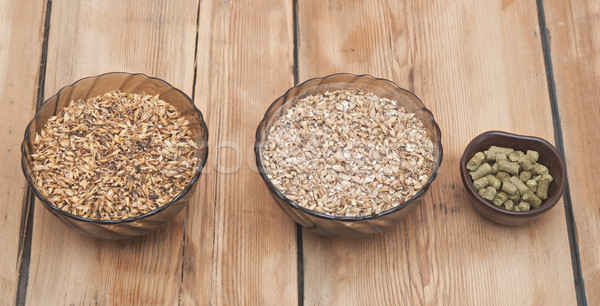 beer ingredients, hops and malt on wooden table top Stock photo © inxti