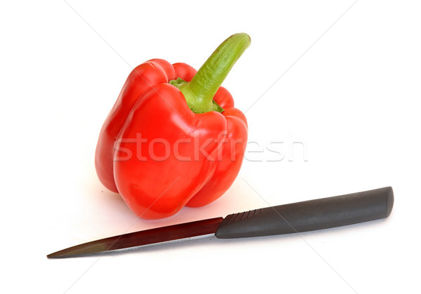 red pepper with a knife on white background  Stock photo © inxti