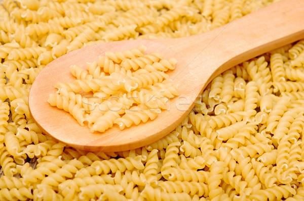 background of pasta and a wooden spoon  Stock photo © inxti