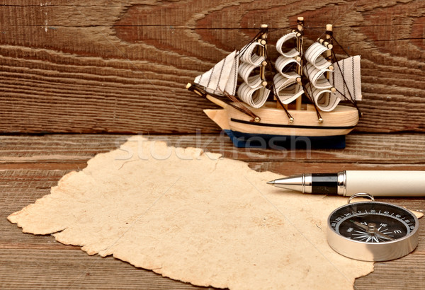 old paper, compass, rope and model classic boat on wood backgrou Stock photo © inxti