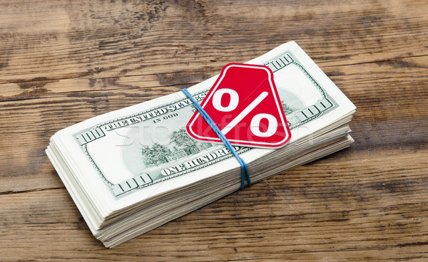 Sign % on the background of one hundred dollar bills  Stock photo © inxti