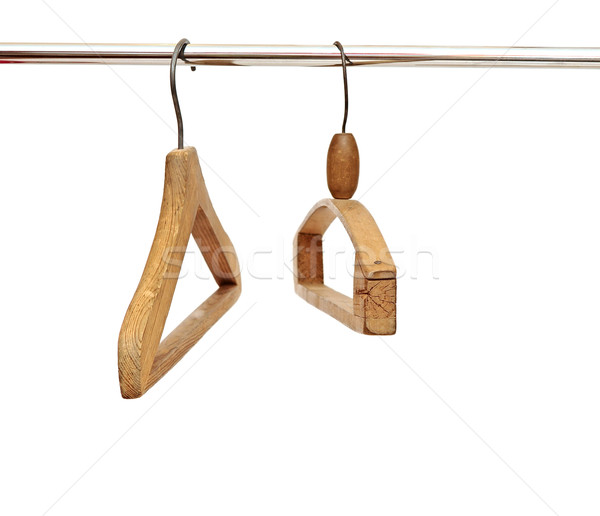 Coat hangers on clothes a rail against white  Stock photo © inxti