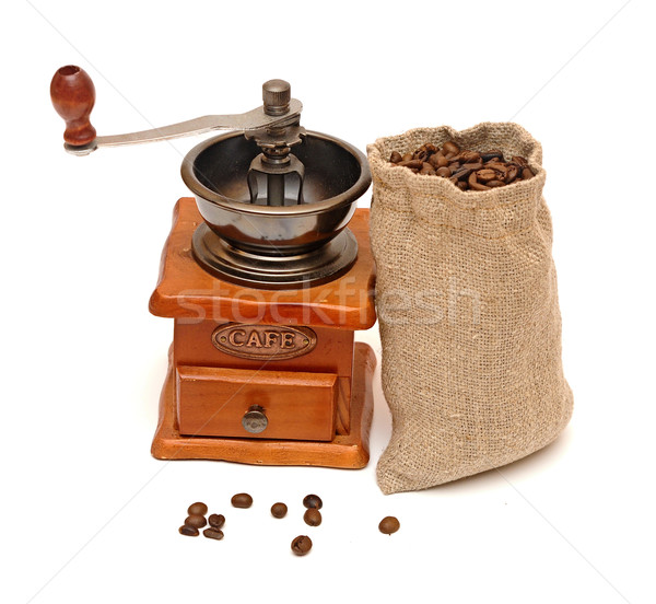 Coffee beans sack with wooden coffee grinder isolated on white b Stock photo © inxti