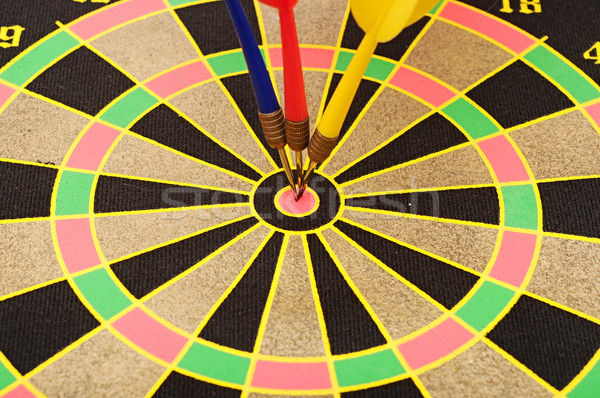 Cut image of dart pierced on target over dartboard  Stock photo © inxti
