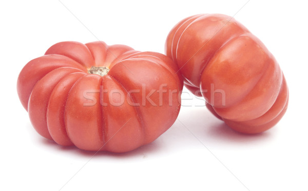 a pair of wrinkled zapotec heirloom tomatoes on a white backgrou Stock photo © inxti