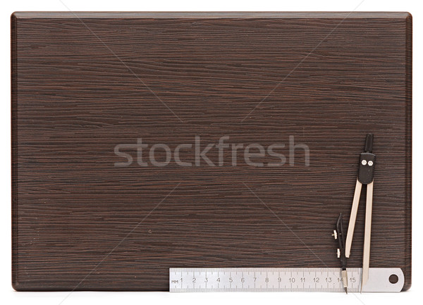 Metal measuring devices on wooden plate including ruler and comp Stock photo © inxti