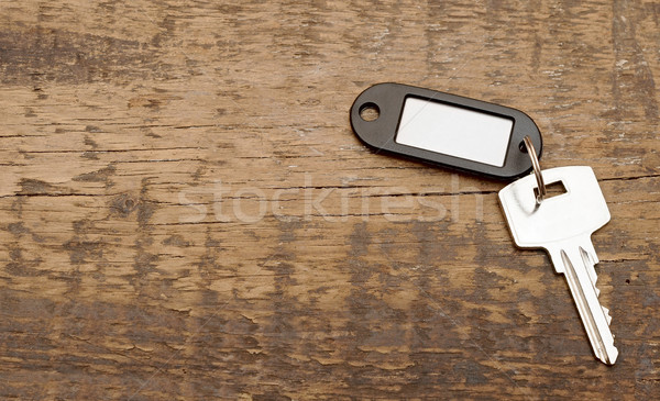 silver key with blank tag wooden background.  space for your tex Stock photo © inxti
