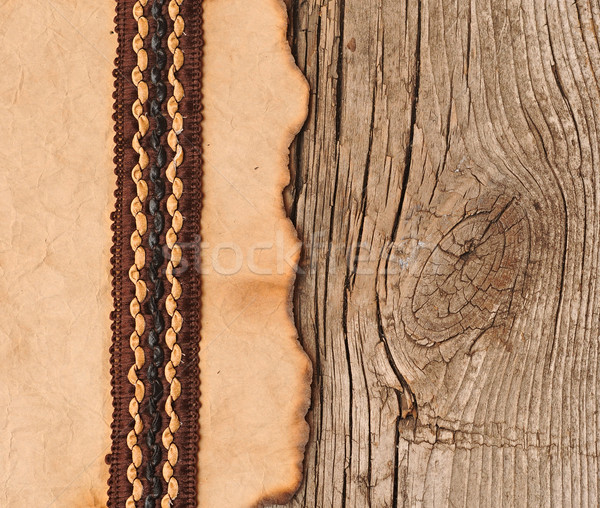 old paper with beutiful ribbon on brown wood texture Stock photo © inxti