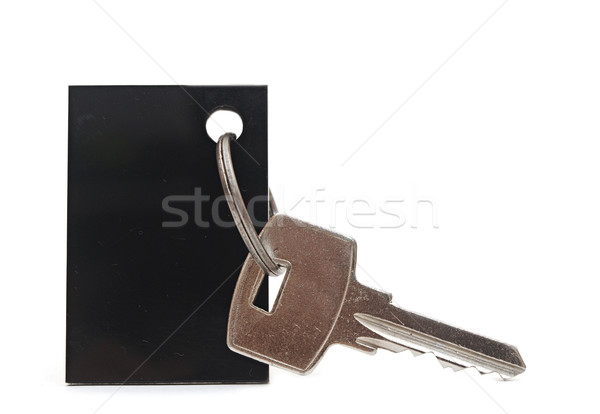 Stock photo: Blank tag and a key isolated on white 