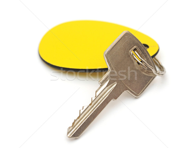 Stock photo: key with a tag on a white background